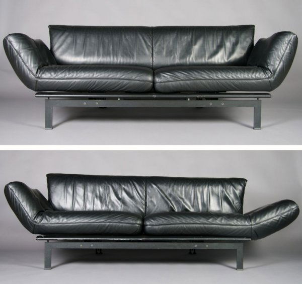 A Pair of Swiss Leather Couches, de Sede, Height 3: A Pair of Swiss Leather Couches, de Sede, designed by Reto Frigg, having black leather upholstery, adjustable armrests and seat cushions that reposition into parallel chaise lounges, raised on a metal