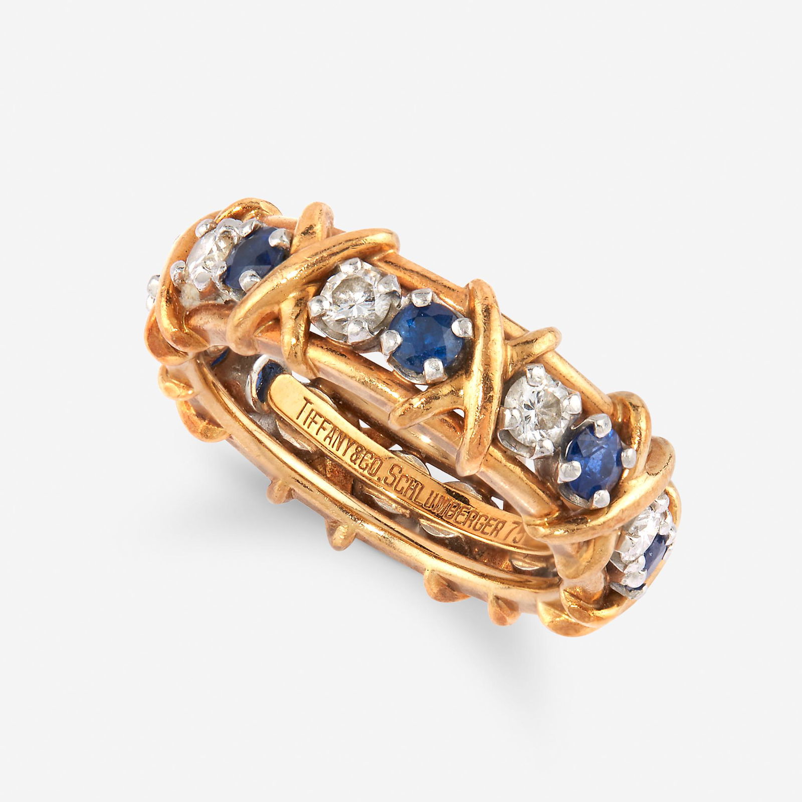 A diamond, sapphire, eighteen karat gold, and platinum (1 of 2)