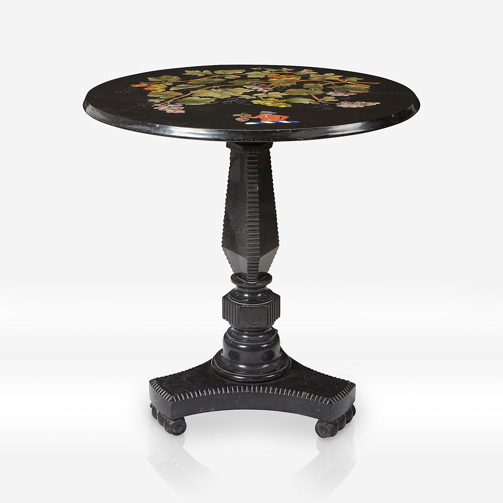 An English pietra dura table, 19th century: An English Ashford black marble and pietra dura table Thomas Woodruff, Buxton, 19th century Engraved beneath table top: "T. WOODRUFF/BUXTON." H: 29 1/2, Dia: 29 in. PROVENANCE: The estate of a promine