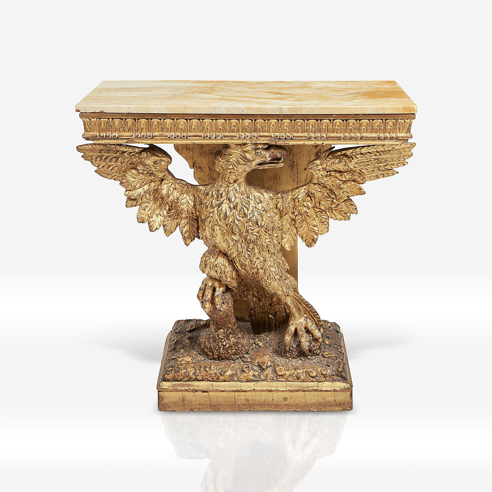 A George II giltwood eagle-form console in the manner: A George II giltwood eagle-form console in the manner of William Kent (English, 1685-1748) 18th century With later Siena marble top.H: 33, W: 35, D: 17 in. PROVENANCE: The estate of a prominent Philad