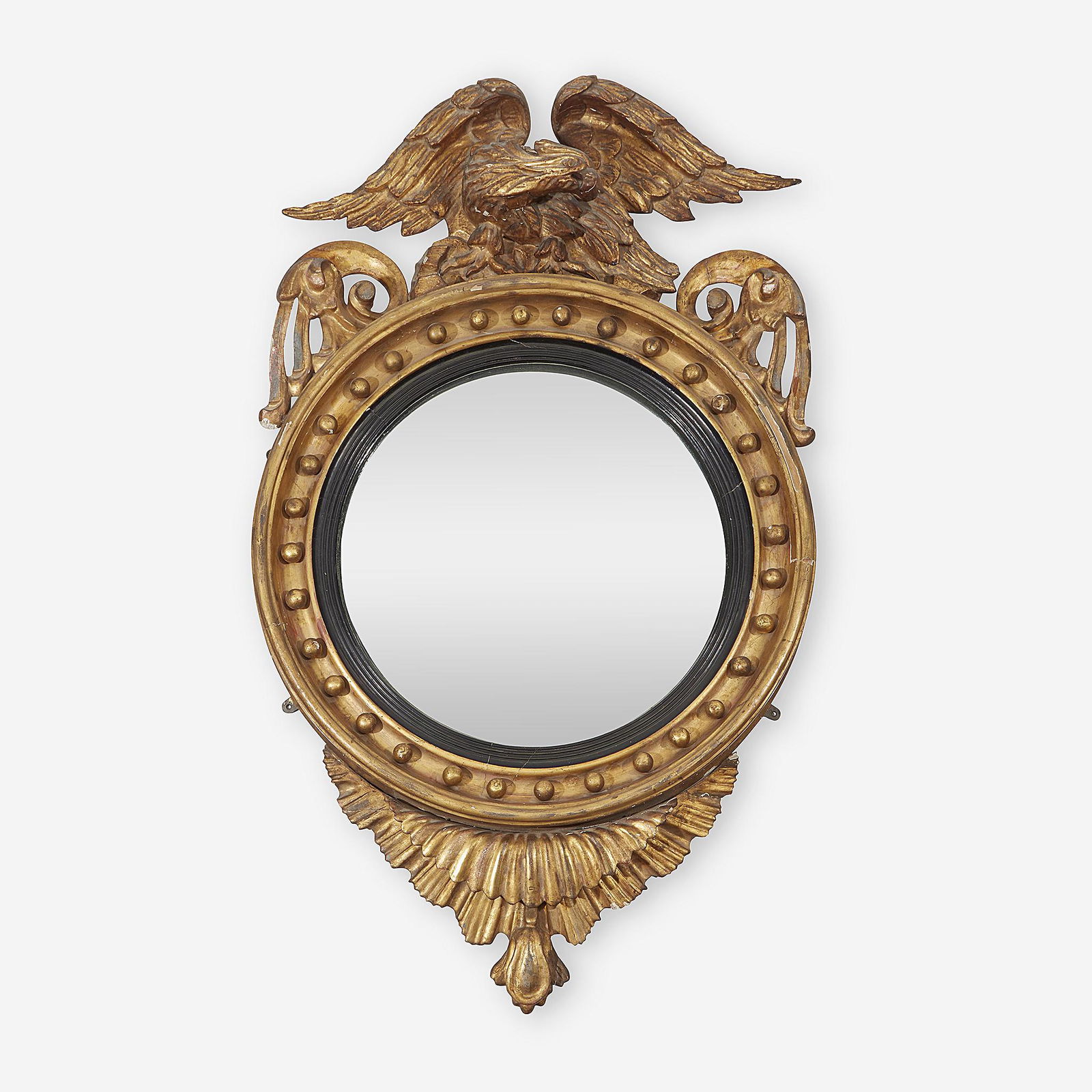 A Regency parcel-ebonized giltwood convex mirror, First (1 of 1)