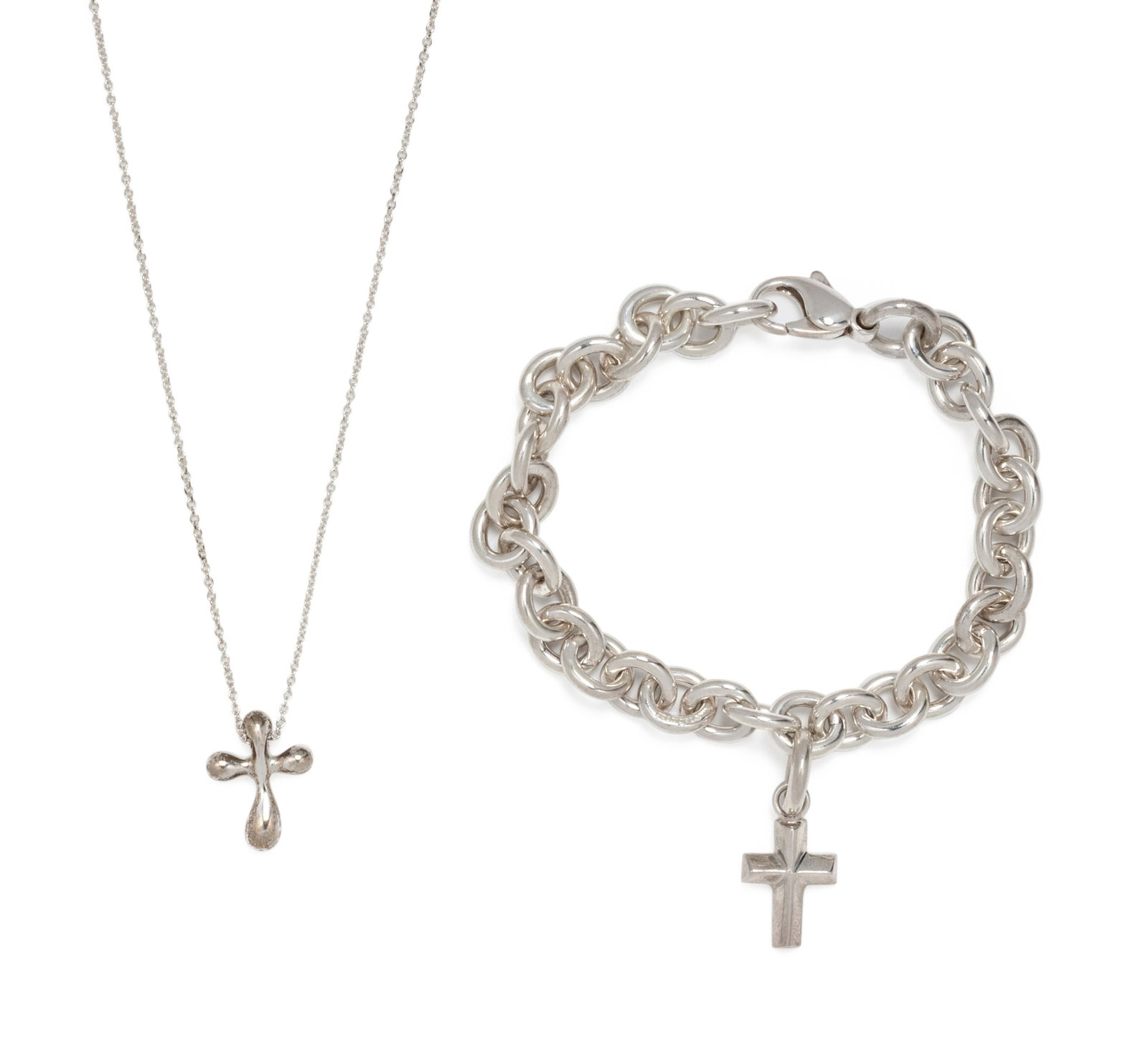 TIFFANY & CO., STERLING SILVER CROSS SET: TIFFANY & CO., STERLING SILVER CROSS SET Consisting of a cable link bracelet suspending a cross pendant by Paloma Picasso, together with a cable link necklace suspending a cross pendant by Elsa Perett