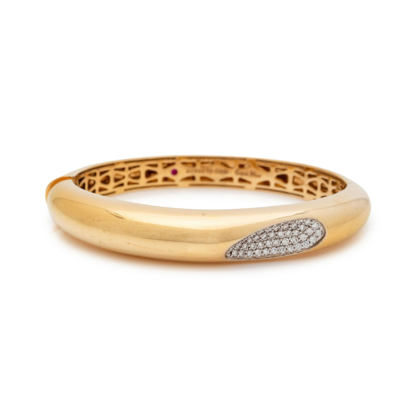 ROBERTO COIN, YELLOW GOLD AND DIAMOND 'CAPRI PLUS': ROBERTO COIN, YELLOW GOLD AND DIAMOND 'CAPRI PLUS' BANGLE BRACELET Containing 50 round brilliant cut diamonds weighing approximately 0.75 carat total, hinged with side clasp. Stamp: ROBERTO COIN Capri