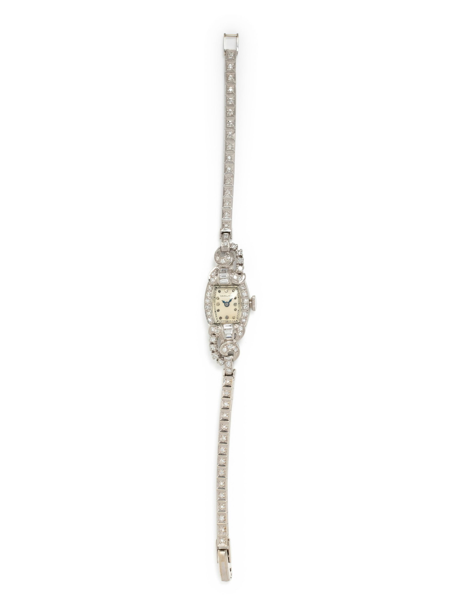 HAMILTON, PLATINUM, WHITE GOLD AND DIAMOND WRISTWATCH: HAMILTON, PLATINUM, WHITE GOLD AND DIAMOND WRISTWATCH The bezel, lugs and bracelet containing six baguette cut diamonds weighing approximately 0.35 carat total and numerous single cut diamonds, off wh