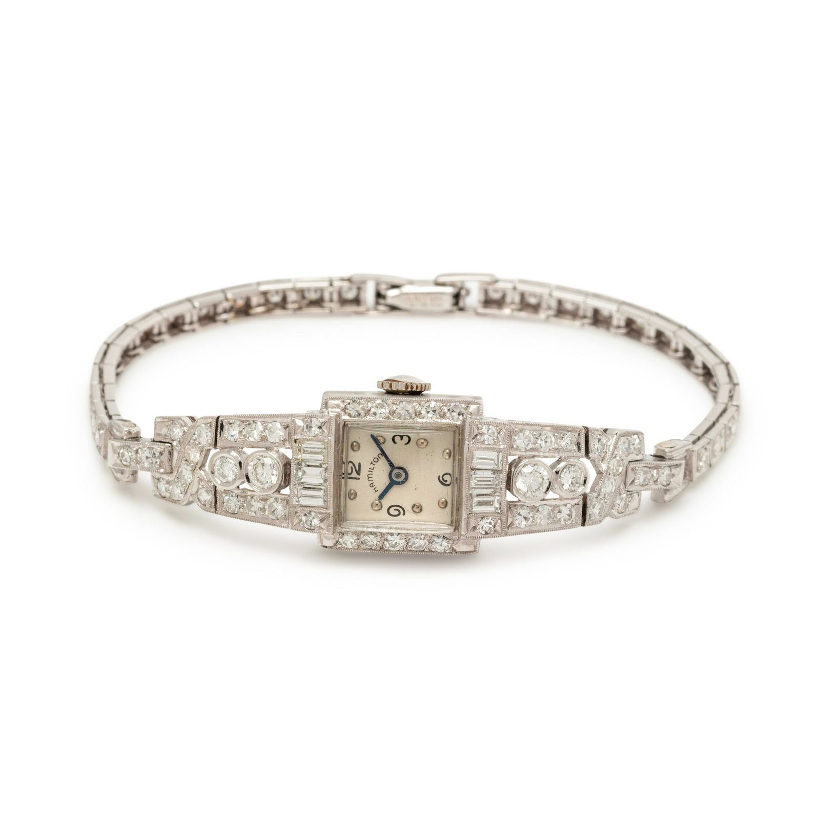 HAMILTON, PLATINUM AND DIAMOND WRISTWATCH: HAMILTON, PLATINUM AND DIAMOND WRISTWATCH The bezel, lugs and bracelet containing four round brilliant cut diamonds weighing approximately 0.45 carat total, six baguette cut diamonds weighing approxim