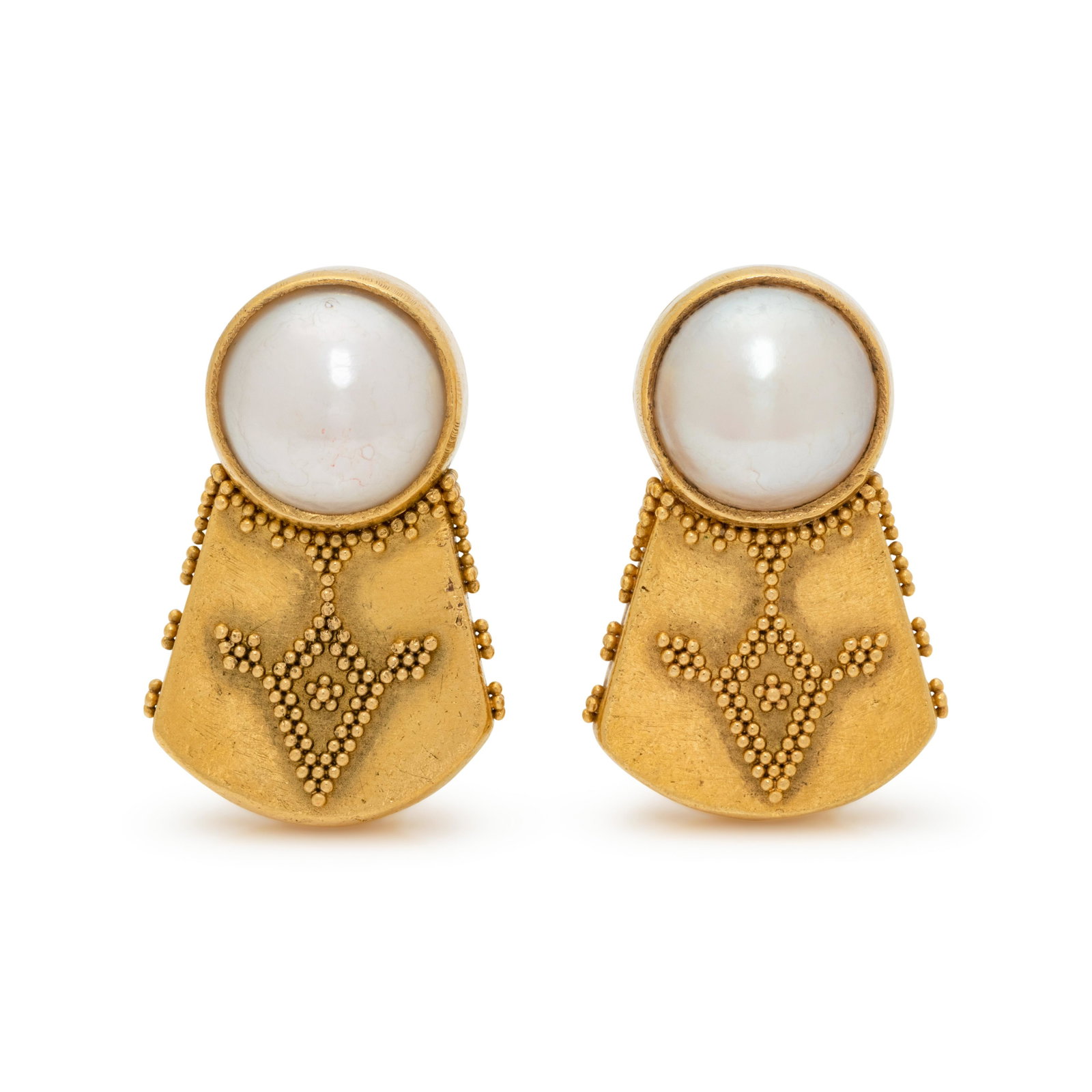 YELLOW GOLD AND CULTURED MABE PEARL EARCLIPS: YELLOW GOLD AND CULTURED MABE PEARL EARCLIPS Containing two mabe pearls measuring approximately 9.00 mm in diameter, with granulation detail. Stamp: 22K (maker's mark) 215. 8.80 dwt. Property from the