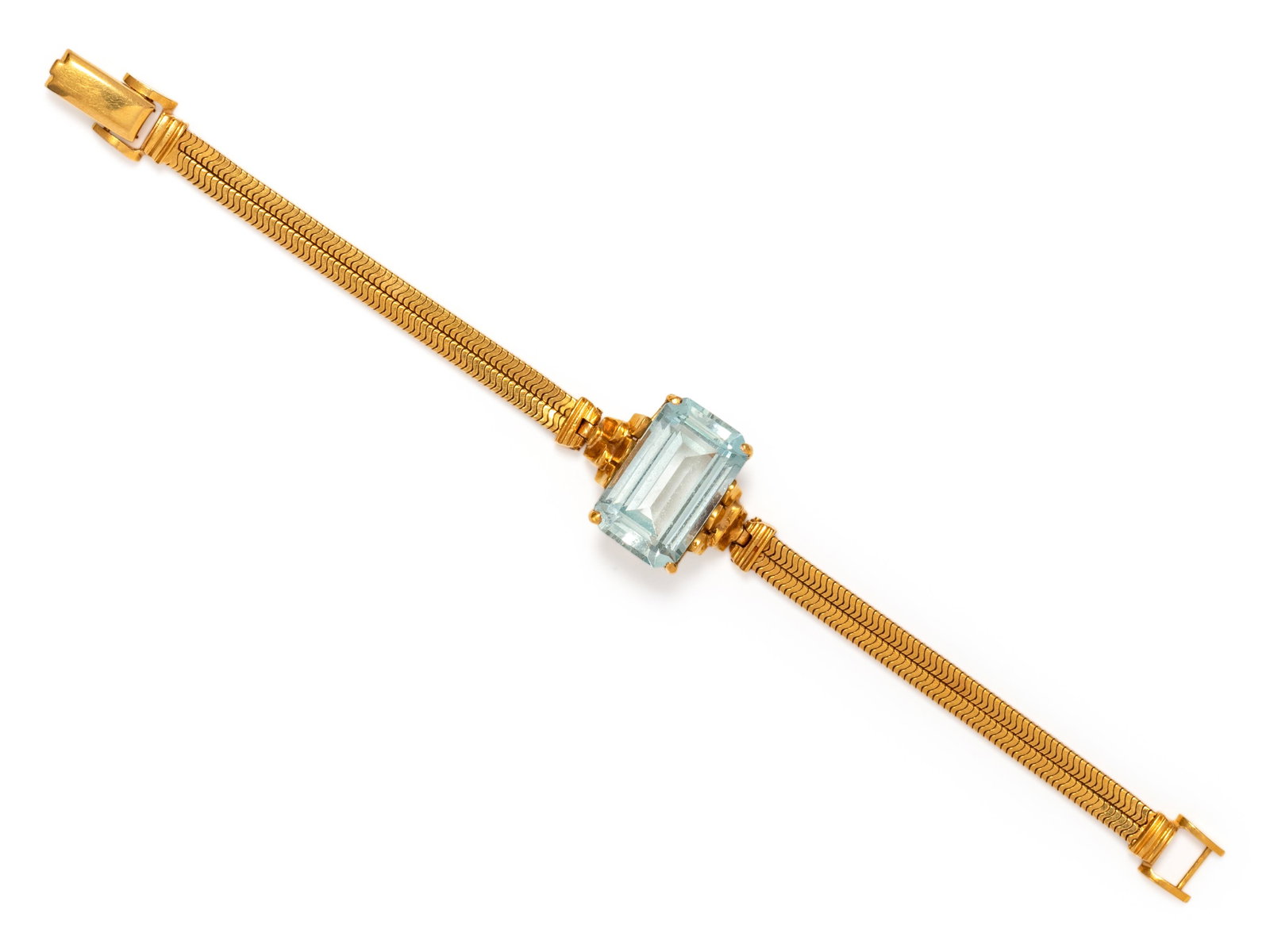 YELLOW GOLD AND AQUAMARINE BRACELET: YELLOW GOLD AND AQUAMARINE BRACELET Consisting of two flat herringbone chains with central aquamarine measuring approximately 19.75 x 12.30 x 8.50 mm. Stamp: 14K. 14.20 dwt.
