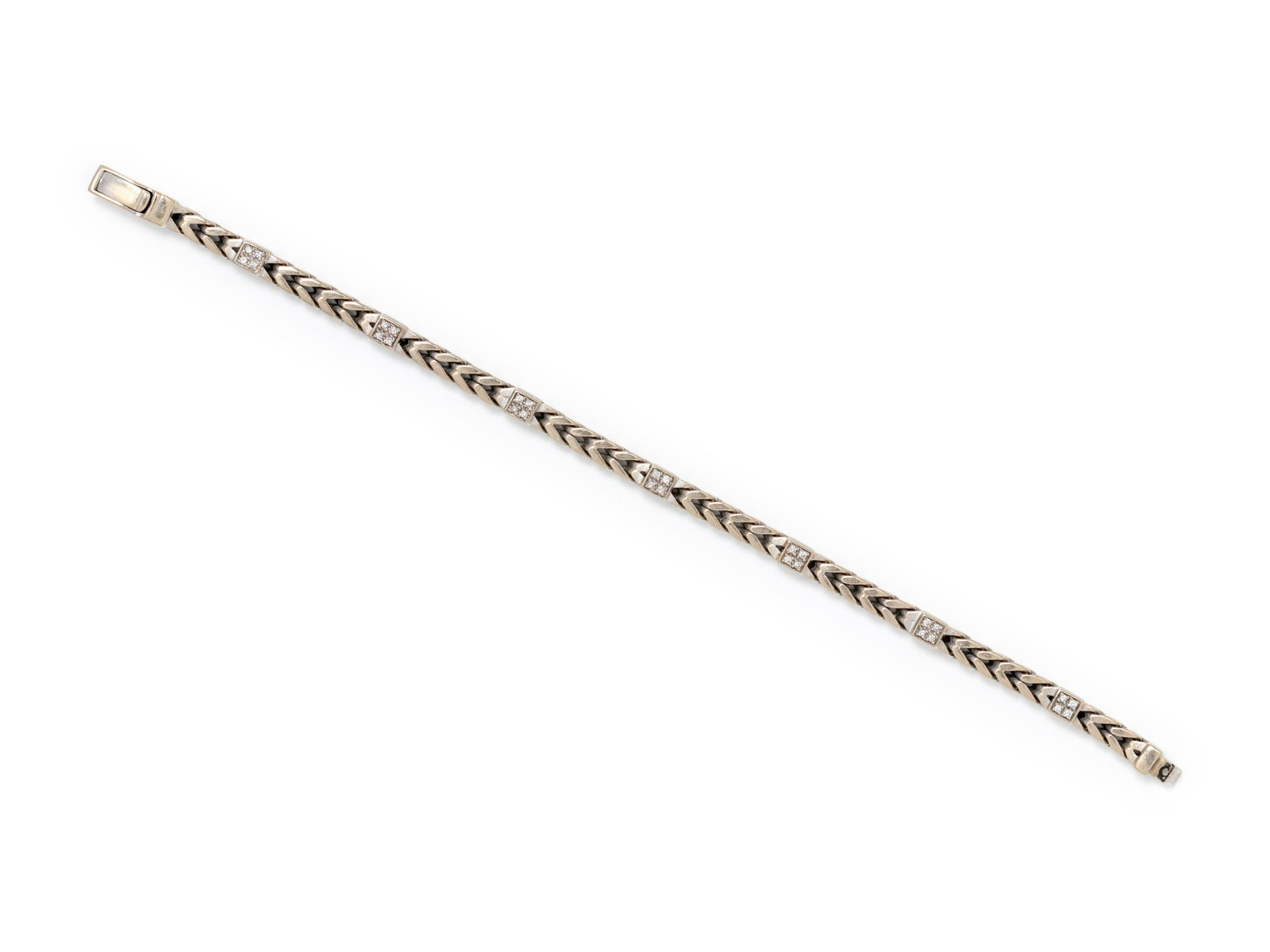 WHITE GOLD AND DIAMOND BRACELET: WHITE GOLD AND DIAMOND BRACELET Consisting of a fancy link chain with seven stations containing 28 round brilliant cut diamonds weighing approximately 0.25 carat total. Stamp: HWC 585. 15.50 dwt.