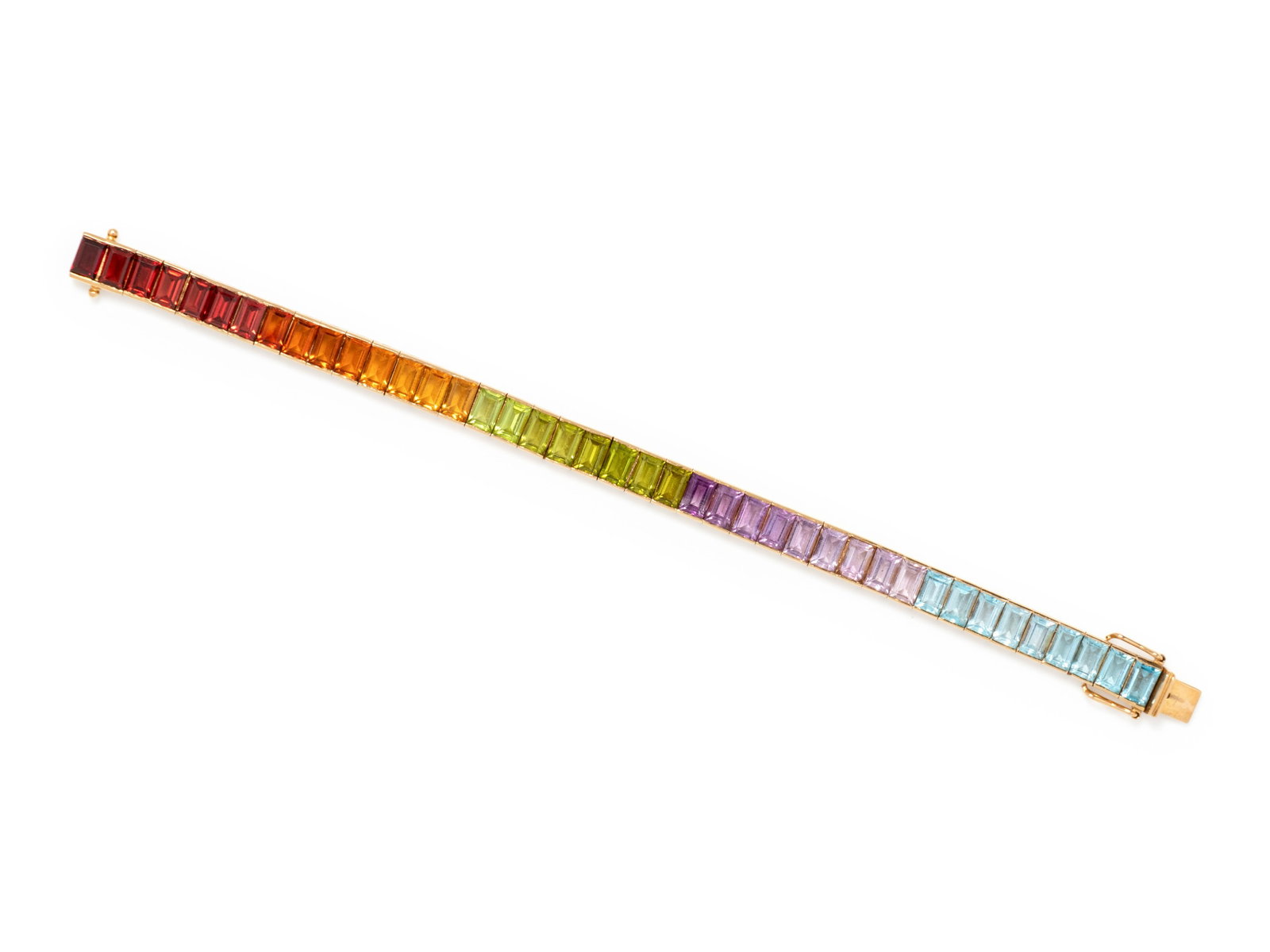 RAINBOW GEMSTONE BRACELET: RAINBOW GEMSTONE BRACELET Containing 41 rectangular step cut gemstones of various color. Mounted in yellow gold. Stamp: 585. 17.20 dwt. Property from the Estate of a Southern Lady