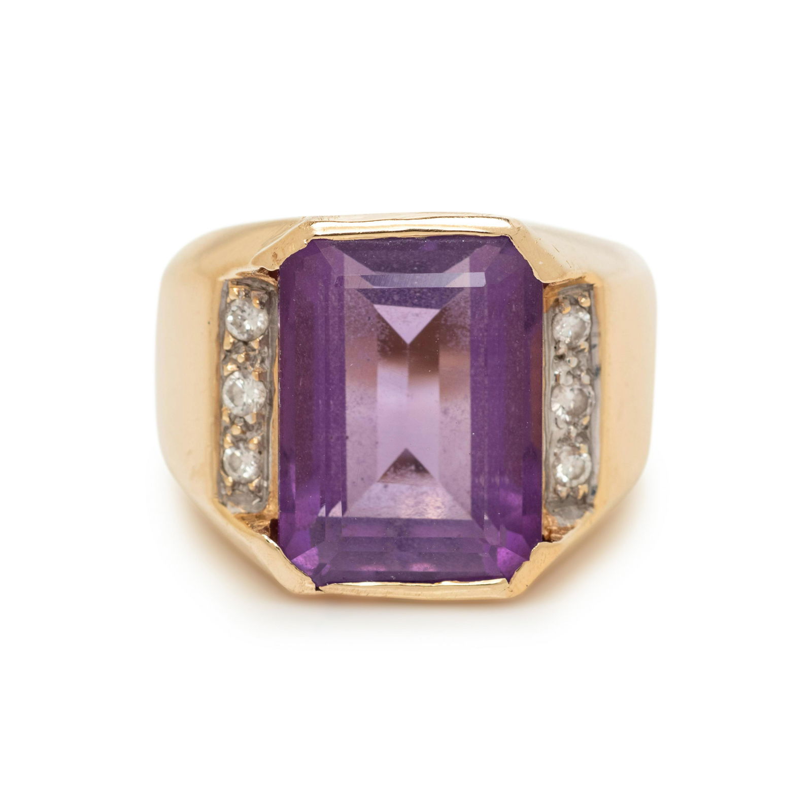 AMETHYST AND DIAMOND RING: AMETHYST AND DIAMOND RING Containing one emerald cut amethyst measuring approximately 13.60 x 10.10 x 7.20 mm and six round brilliant cut diamonds. Mounted in yellow gold. Stamp: 1(obscured). 5.05 dwt