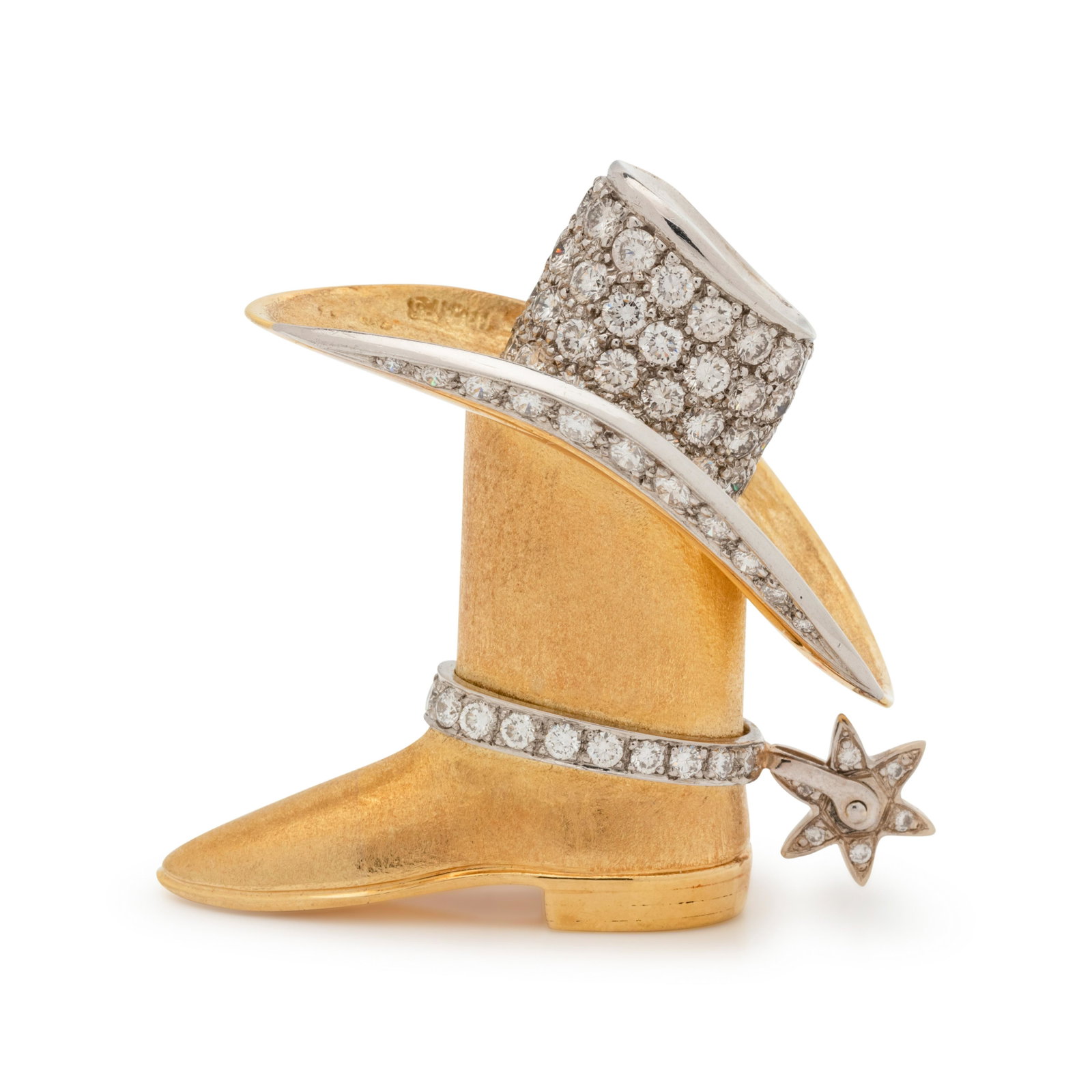 YELLOW GOLD AND DIAMOND BOOT AND HAT PENDANT: YELLOW GOLD AND DIAMOND BOOT AND HAT PENDANT Consisting of a matte yellow gold boot with platinum hat, strap and articulated spur containing 77 round brilliant cut diamonds weighing approximately 4.35