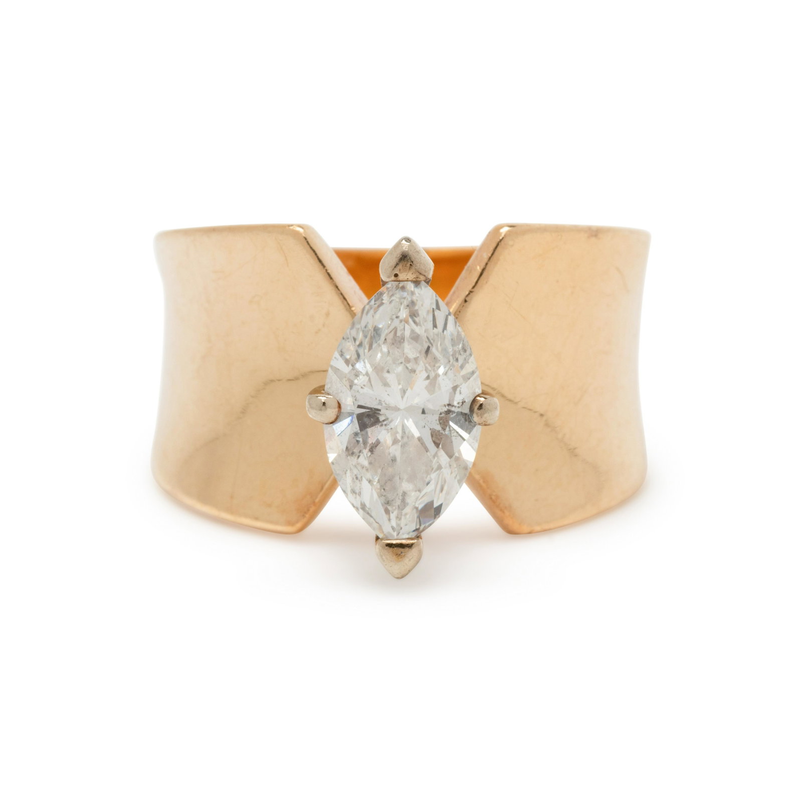 YELLOW GOLD AND DIAMOND RING: YELLOW GOLD AND DIAMOND RING Containing one marquise cut diamond weighing approximately 1.30 carats. Stamp: 14K *. 5.50 dwt. From The Estate of Cathy D. Perry, Ocala, Florida