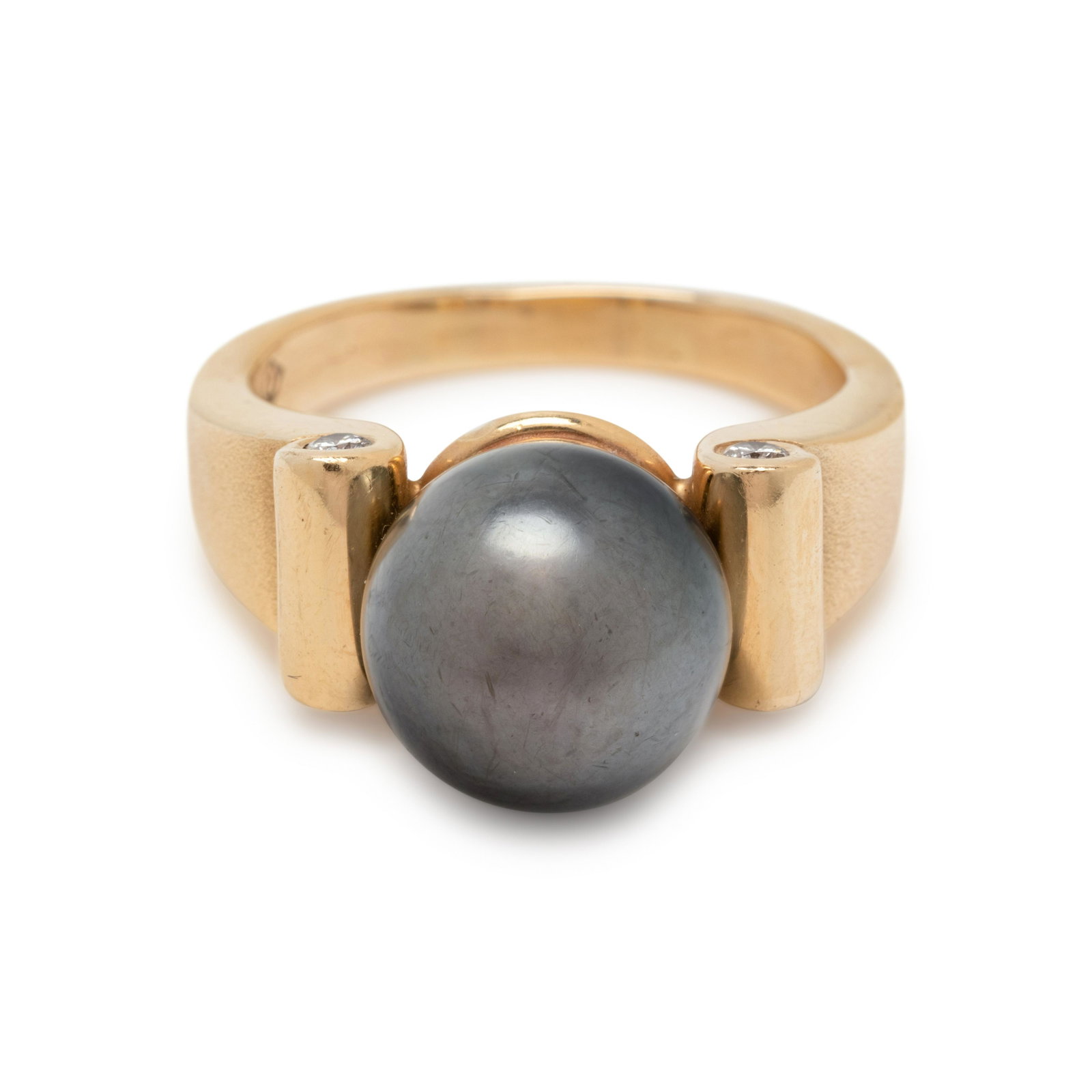 CULTURED TAHITIAN PEARL AND DIAMOND RING: CULTURED TAHITIAN PEARL AND DIAMOND RING Containing one Tahitian pearl measuring approximately 10.85 mm in diameter and four round brilliant cut diamonds. Mounted in yellow gold. Stamp: 14K (maker's m
