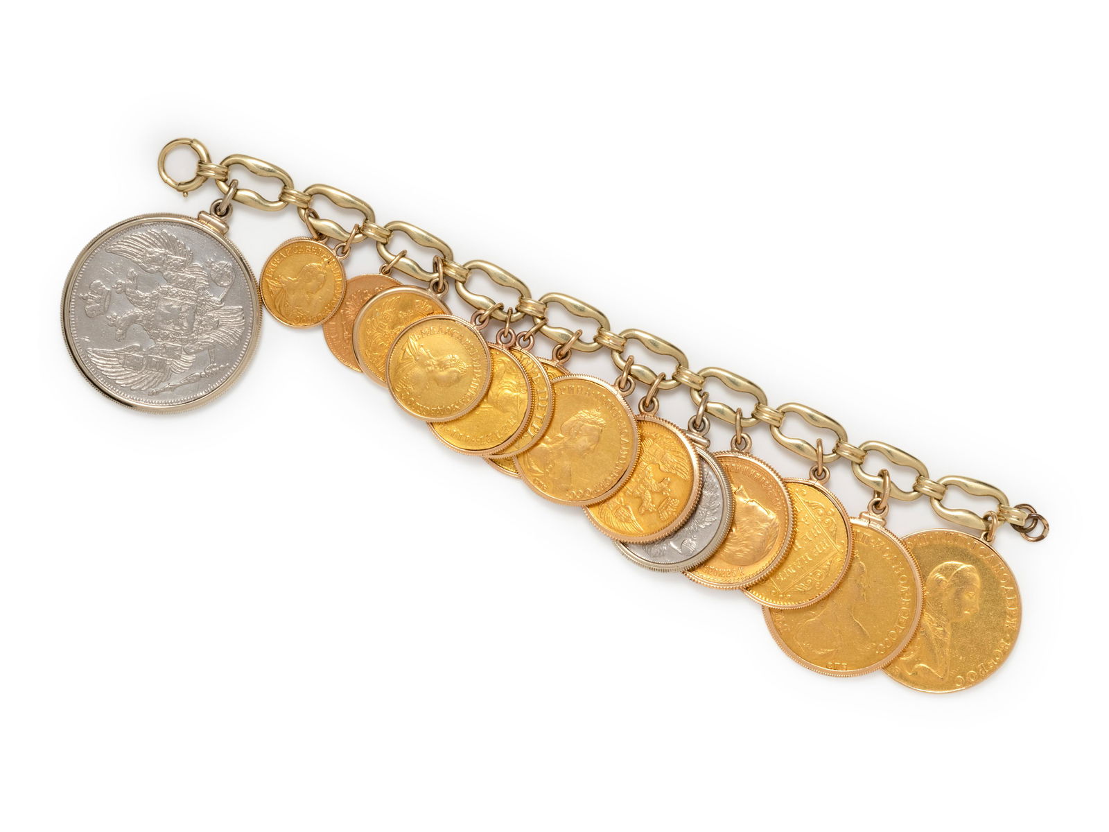 YELLOW GOLD AND COIN BRACELET: YELLOW GOLD AND COIN BRACELET Consisting of a fancy link chain suspending 16 Russian coins of various date and denominations. Clasp stamp: 14K. 113.85 dwt. Property of a Midwestern Museum