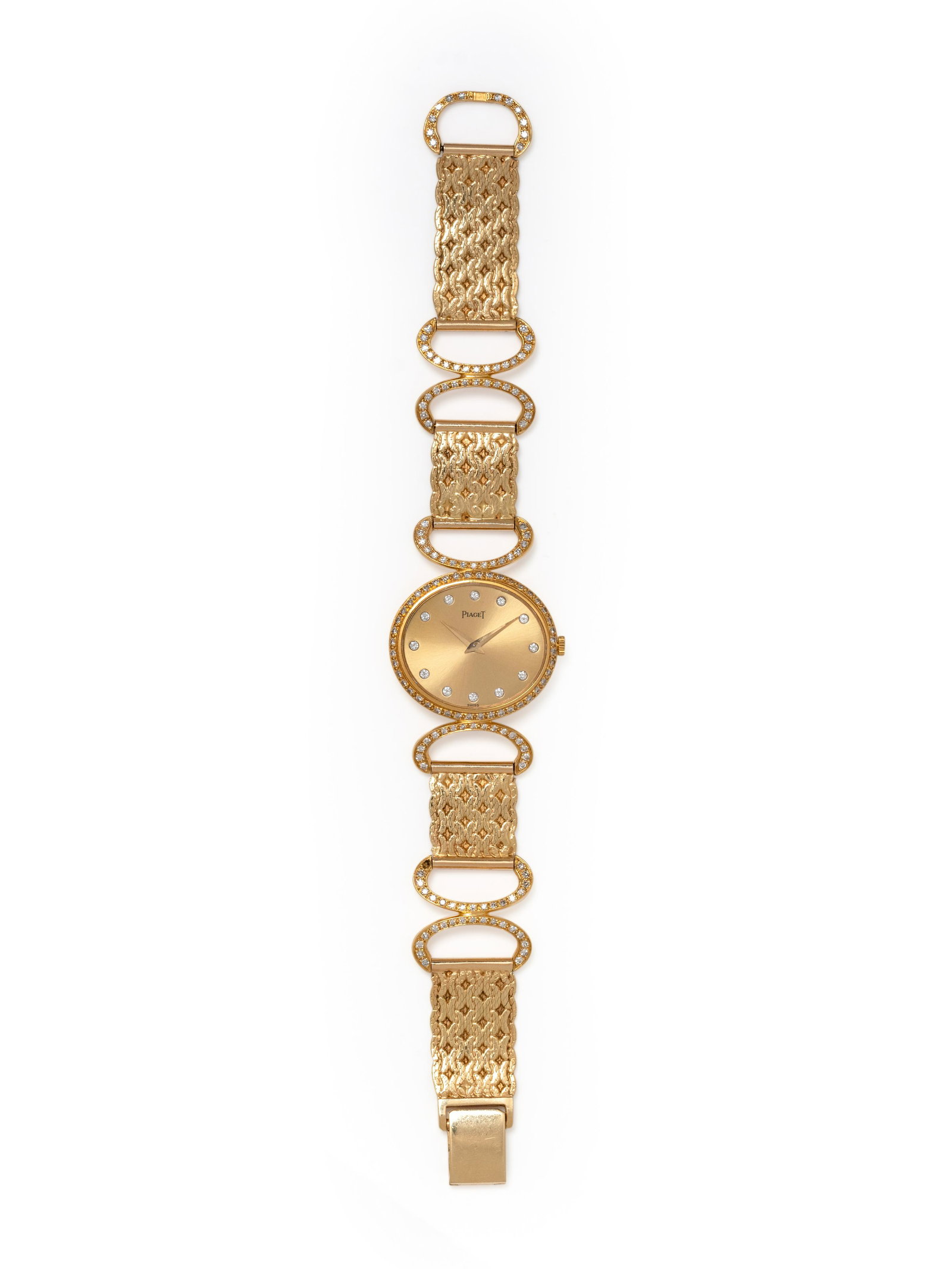 PIAGET, 18K YELLOW GOLD AND DIAMOND WRISTWATCH: PIAGET, 18K YELLOW GOLD AND DIAMOND WRISTWATCH 26.00 x 24.00 mm case dimensions, matte gold dial, round brilliant cut diamond numerals, manual wind movement, integrated gold openwork bracelet and beze