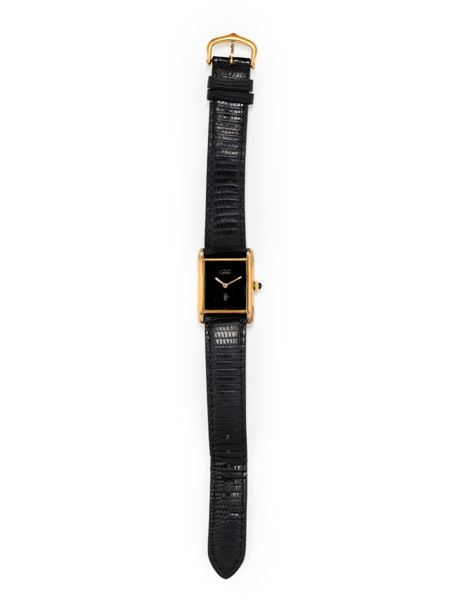 CARTIER, GOLD VERMEIL 'MUST DE CARTIER' WRISTWATCH: CARTIER, GOLD VERMEIL 'MUST DE CARTIER' WRISTWATCH 30.00 x 22.00 mm case dimensions inclusive of lugs, black dial, manual wind movement, black leather strap signed Cartier, gold tone tang buckle. Case