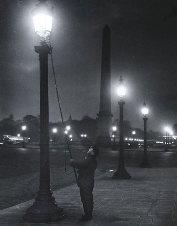 Brassai, (French, 1899-1984), Lighting the Lamps, Place: Brassai (French, 1899-1984) Lighting the Lamps, Place de la Concorde, c. 1932-1933 gelatin silver print numbered 373, stamped and signed (on the verso) 11 1/2 x 9 1/4 inches.