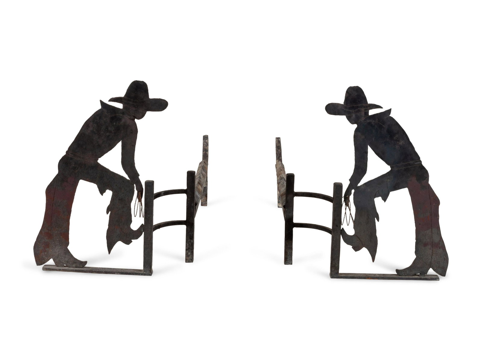 Pair of Cowboy Motif Andirons each height 17 x width 30: Pair of Cowboy Motif Andirons sheet metal, depicting a cowboy with a lasso each height 17 x width 30 inches Property of a Sun Valley, Idaho Collector