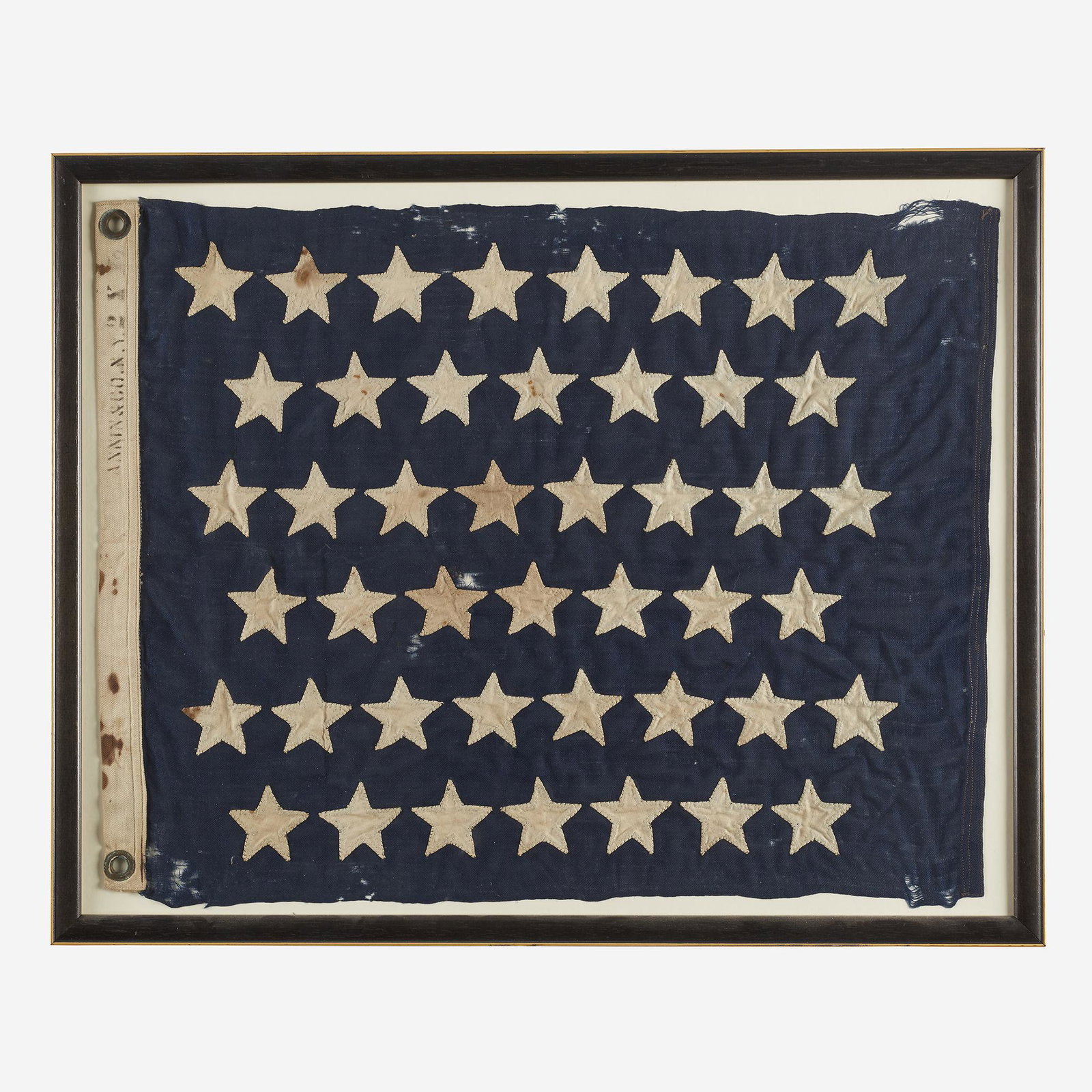 A 45-Star Naval Jack commemorating Utah statehood ,: A 45-Star Naval Jack commemorating Utah statehoodStamped, "Annin & Co. NY., " 1896-1908Hand-sewn cotton stars on wool bunting, canvas hoist with two grommets,framed.23 3/4 in. x 18 1/2 in. (sight)PROV