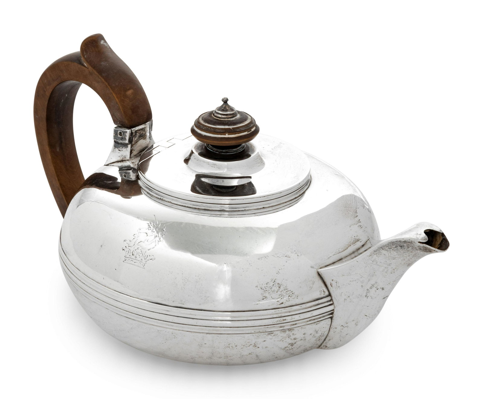 A George III Silver Teapot: A George III Silver Teapot Maker's Mark 'IE [over] EE', London, 1812 hallmarked for Sterling on underside 18 ozt 1 dwt gross Height 5 x width 9 1/4 inches. Property from the Estate of W.M. Bogda