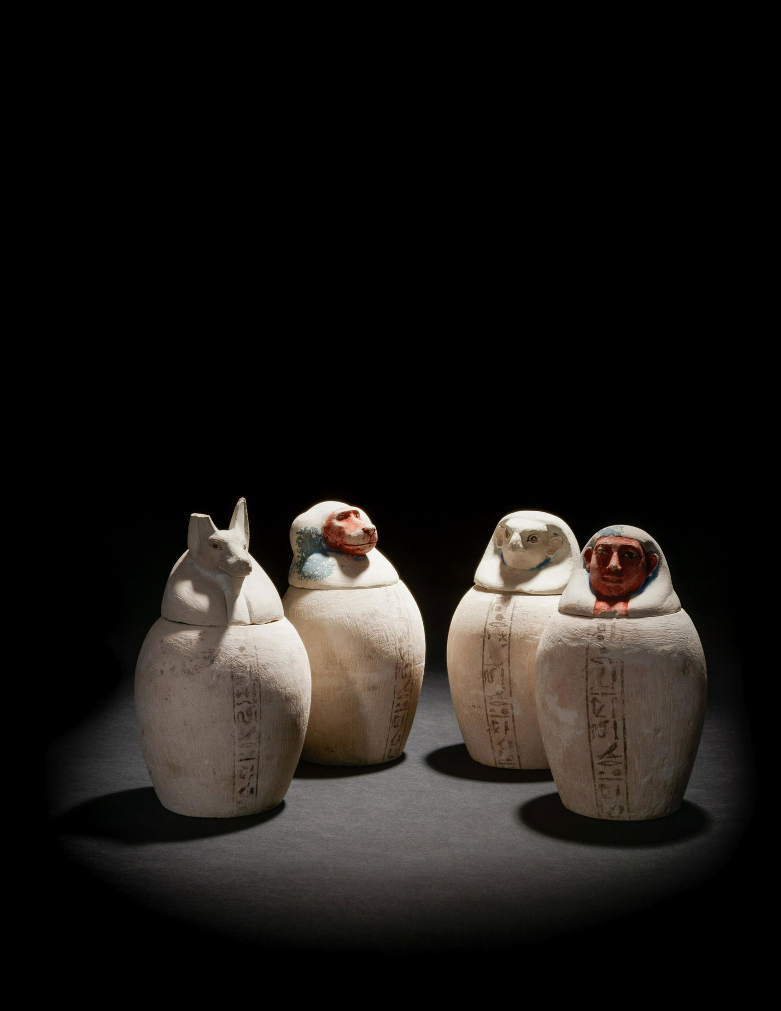 A Set of Four Egyptian Painted Limestone Canopic Jars (1 of 12)