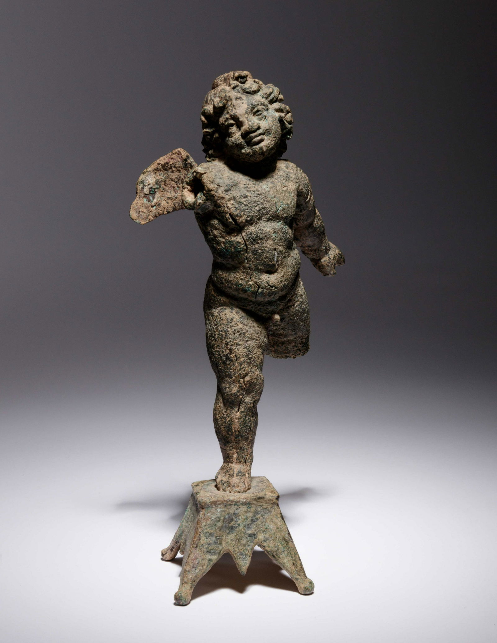 A Roman Bronze Figure of Eros Height 6 1/2 inches. (1 of 5)