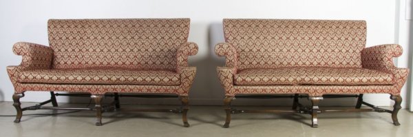 A Pair of Mahogany Upholstered Settees, Length 66 i: A Pair of Mahogany Upholstered Settees, the upholstered back, arms, and seat, raised on carved legs joined by stretchers. Length 66 inches.