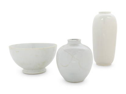 Three Chinese White Glazed Porcelain Articles: Three Chinese White Glazed Porcelain Articles QING DYNASTY (1644-1912) comprising two vases and a large bowl. Height of largest 10 1/4 in., 26 cm.