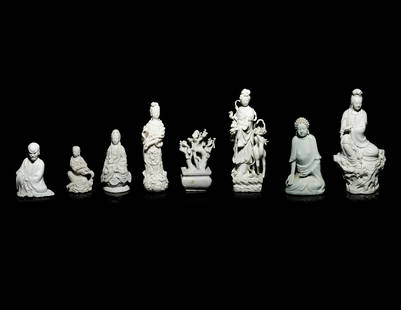 Eight Chinese Monochrome Glazed Porcelain Articles: Eight Chinese Monochrome Glazed Porcelain Articles 20TH CENTURY comprising five Blanc-de-Chine Guanyin figures, one Blanc-de-Chine Buddha, one Blanc-de-Chine model of a tree, and one Qingbai-glazed fi