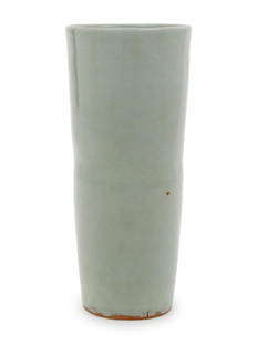 A Chinese Celadon Glazed Porcelain Cylindrical Vase: A Chinese Celadon Glazed Porcelain Cylindrical Vase potted in a tapering cylindrical form, covered inside and out with a soft blue-green tone glaze. Height 7 in., 17.78 cm.