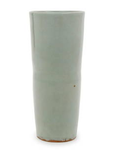 A Chinese Celadon Glazed Porcelain Cylindrical Vase: A Chinese Celadon Glazed Porcelain Cylindrical Vase potted in a tapering cylindrical form, covered inside and out with a soft blue-green tone glaze. Height 7 in., 17.78 cm.