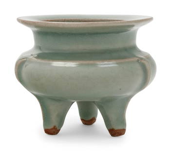 A Chinese Celadon Glazed Porcelain Tripod Censer: A Chinese Celadon Glazed Porcelain Tripod Censer of compressed globular form with a slightly tapered neck and broad everted rim, supported on three splayed legs, covered overall with a celadon-green