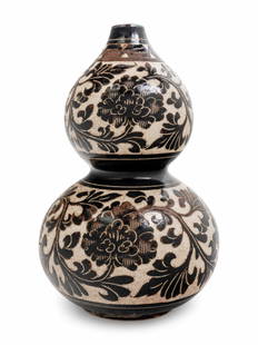 A Chinese Sgraffito White Ground Black Decorated Double: A Chinese Sgraffito White Ground Black Decorated Double Gourd Vase decorated with dark brown meandering peony scroll, the feathery leafy stems supporting large open peony blooms, all against a