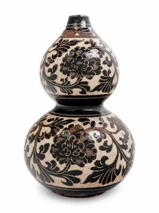 A Chinese Sgraffito White Ground Black Decorated Double: A Chinese Sgraffito White Ground Black Decorated Double Gourd Vase decorated with dark brown meandering peony scroll, the feathery leafy stems supporting large open peony blooms, all against a creamy-