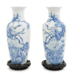 A Pair of Chinese Blue and White Porcelain Vases: A Pair of Chinese Blue and White Porcelain Vases 20TH CENTURY each finely potted of baluster form, decorated with cranes, the undersides bearing apocryphal Qianlong six-character marks, and each raise