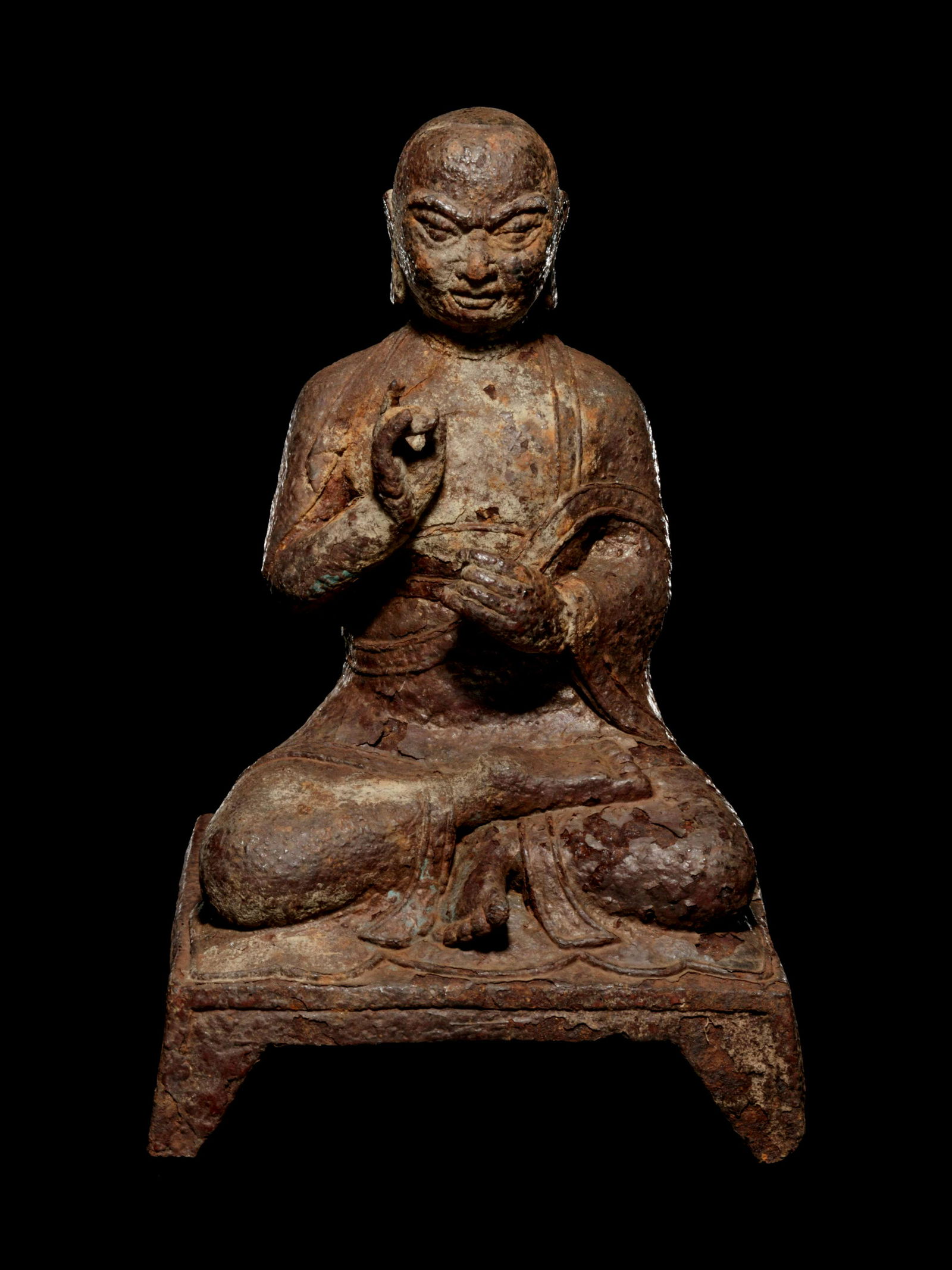 A Tibetan Cast Iron Figure of a Monk (1 of 3)
