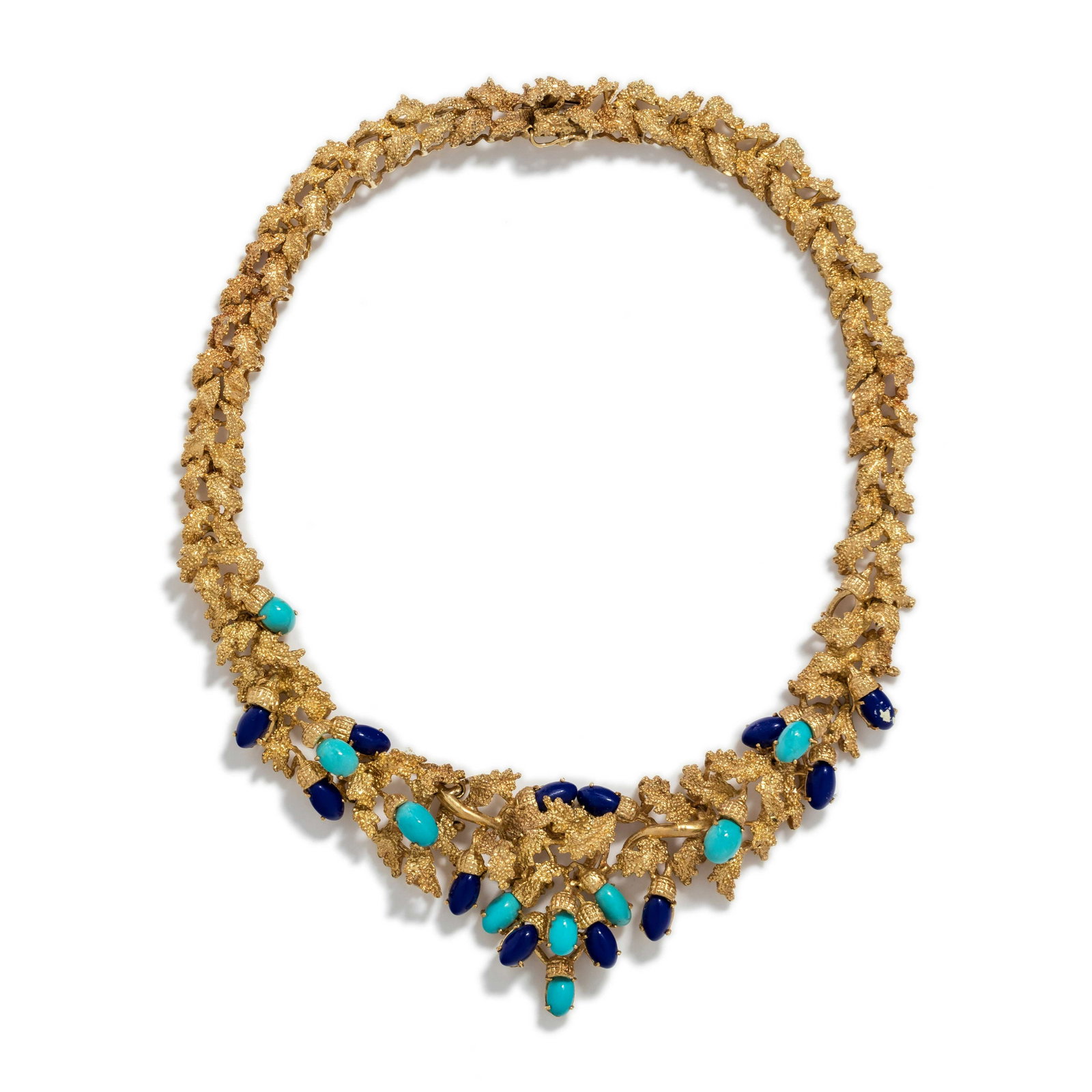 YELLOW GOLD, LAPIS LAZULI AND TURQUOISE COLLAR NECKLACE: YELLOW GOLD, LAPIS LAZULI AND TURQUOISE COLLAR NECKLACE Consisting of textured leaf links containing 12 oval cabochon lapis lazuli and nine oval cabochon turquoise. 15 inches long. Stamp: 750. 76.70 d