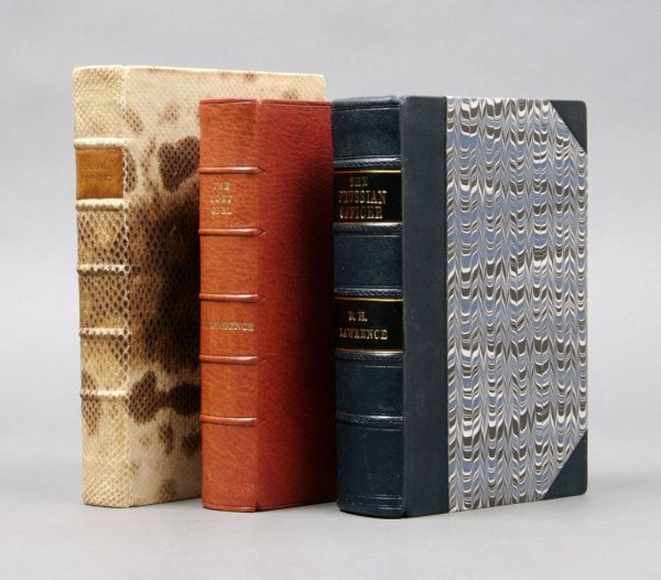 LAWRENCE, D. H. A set of 2 first editions in leathe: LAWRENCE, D. H. A set of two first editions in leather bindings and one later edition in snakeskin binding. The Prussian Officer. London: Duckworth, (1914). 8vo, 3/4 leather over marbled boards, 5 rai
