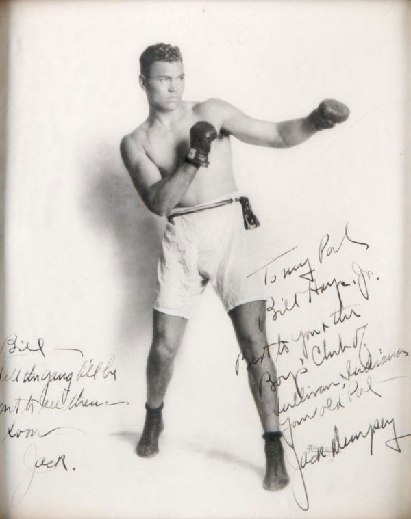 DEMPSEY, JACK. Inscribed photograph.: DEMPSEY, JACK Signed photograph of Jack Dempsey in boxing gear. Inscribed twice, once to Will Hays reading "Bill - Tell the gang I'll be out to see them soon - Jack," and to Will Hays Jr. reading "To