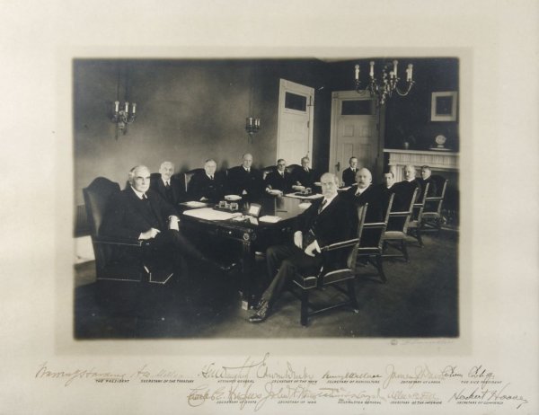 HARDING, WARREN G. Official photograph of Harding's: HARDING, WARREN G. Official 1921 White House photograph of Warren G. Harding with members of his cabinet, signed by each. From the collection of Will Hays. Photograph and signatures include Harding, S