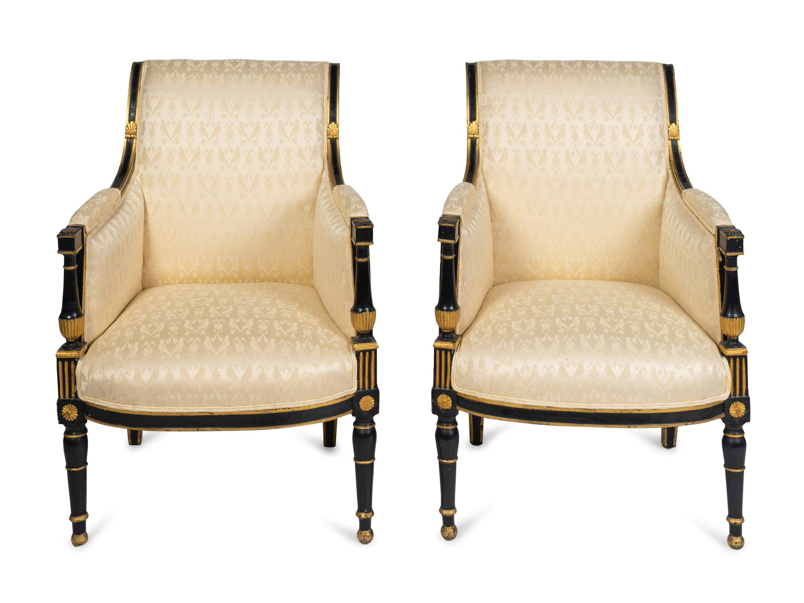 A Pair of Directoire Parcel-Gilt and Painted Bergeres: A Pair of Directoire Parcel-Gilt and Painted Bergeres EARLY 19TH CENTURY Height 35 x width 23 1/4 inches.