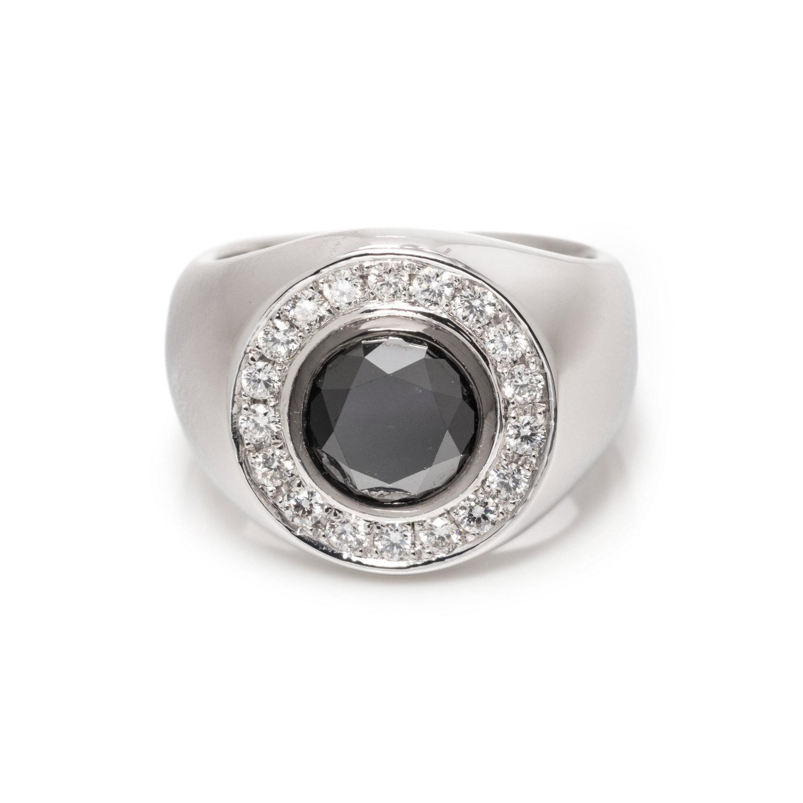 BLACK DIAMOND AND DIAMOND RING: BLACK DIAMOND AND DIAMOND RING Containing one round mixed cut black diamond measuring approximately 7.05 mm in diameter and 18 round brilliant cut diamonds weighing approximately 0.20 carat total. Mou