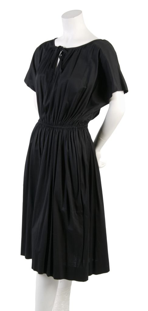 A Missoni Black Day Dress, Size M.: A Missoni Black Day Dress, 1980s, with a short kimono sleeves, gathering around neckline, cinched waist leading into slightly flared skirt. Labeled: Missoni. Size M.