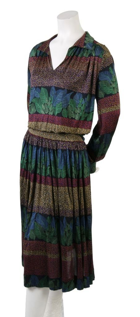 A Missoni Blouse and Skirt Ensemble, Size 46.: A Missoni Blouse and Skirt Ensemble, 1980s, striped with one panel in small dots and the other in blue and green leaves, V-neckline with pointed collar, full blouse that cinches at hem, flared skirt.