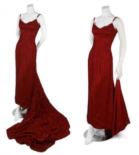 A Morgane Le Fay Red Velvet Gown, Size S.: A Morgane Le Fay Red Velvet Gown, with boned and fitted bodice, thin double straps, long train, fully lined. Labeled: Morgane Le Fay/Designed by Liliana Casabal/Bergdorf Goodman. Size S.