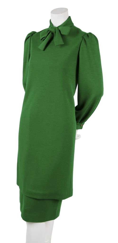 A Bill Blass Green Wool Jersey Ensemble,: A Bill Blass Green Wool Jersey Ensemble, 1981, tunic dress with pleated shoulders, band collar with bow, straight skirt with waistband, fully lined. Labeled: Bill Blass.