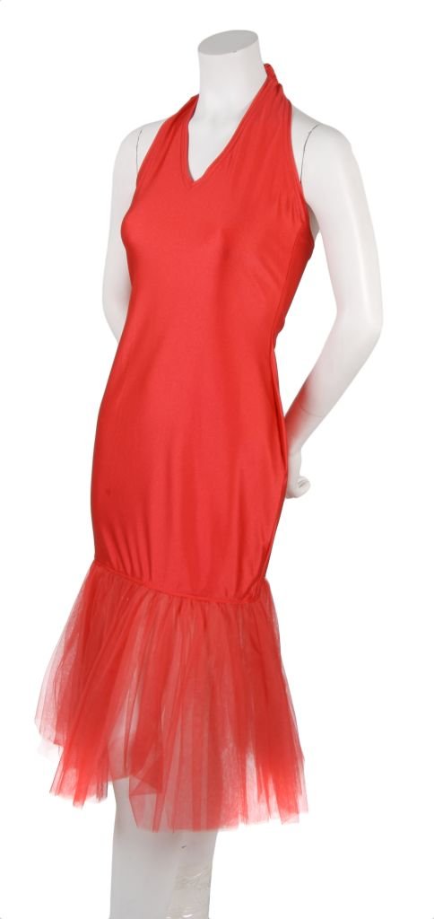 A Patrick Kelly Red Spandex and Tulle Dress, Size 2.: A Patrick Kelly Red Spandex and Tulle Dress, 1990s, with tie-back halter and v-neck, gathered tulle skirt. Labeled: Patrick Kelly/Paris. Size 2.