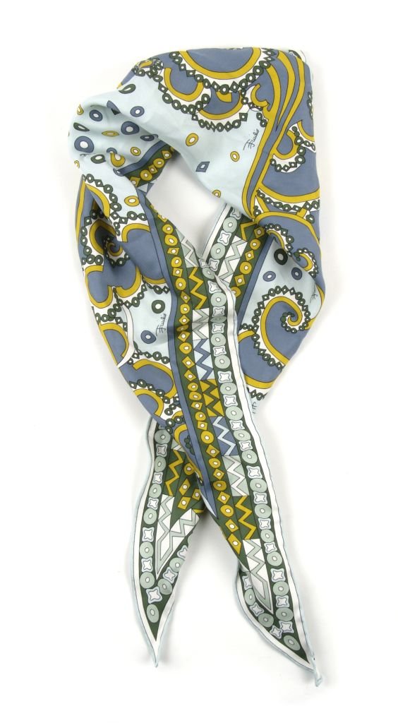 An Emilio Pucci Geometric Print Scarf, 40 x 14 inches.: An Emilio Pucci Geometric Print Scarf, in a trapezoidal shape. Labeled: Emilio Pucci. 40 x 14 inches.