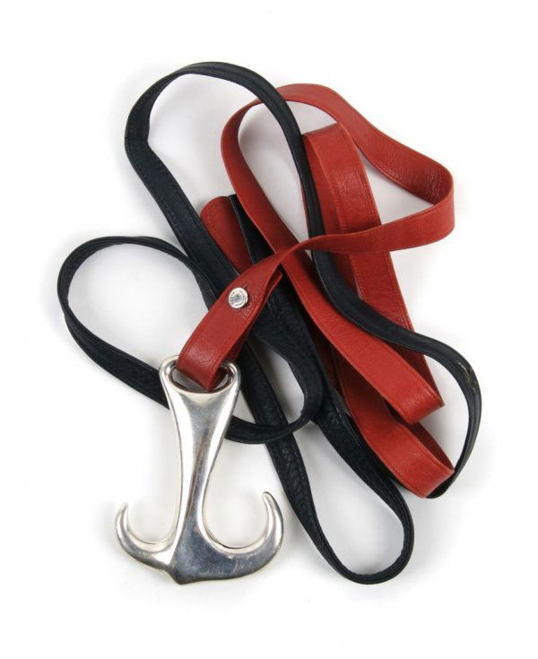 An Elsa Peretti for Tiffany & Co. Sterling Silver Belt Buckle,: An Elsa Peretti for Tiffany & Co. Sterling Silver Belt Buckle, in the shape of an anchor, with two interchangeable red and navy leather belts. Stamped: Peretti-Tiffany.