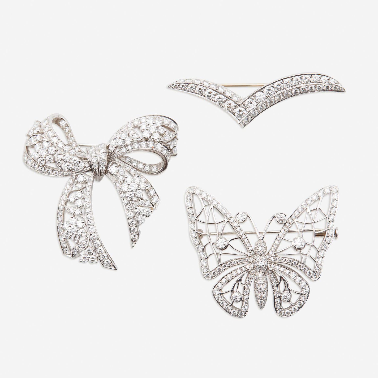 A collection of three platinum and diamond brooches, (1 of 1)